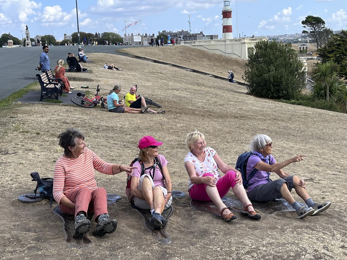 Walkers resting on Plymouth Hoe